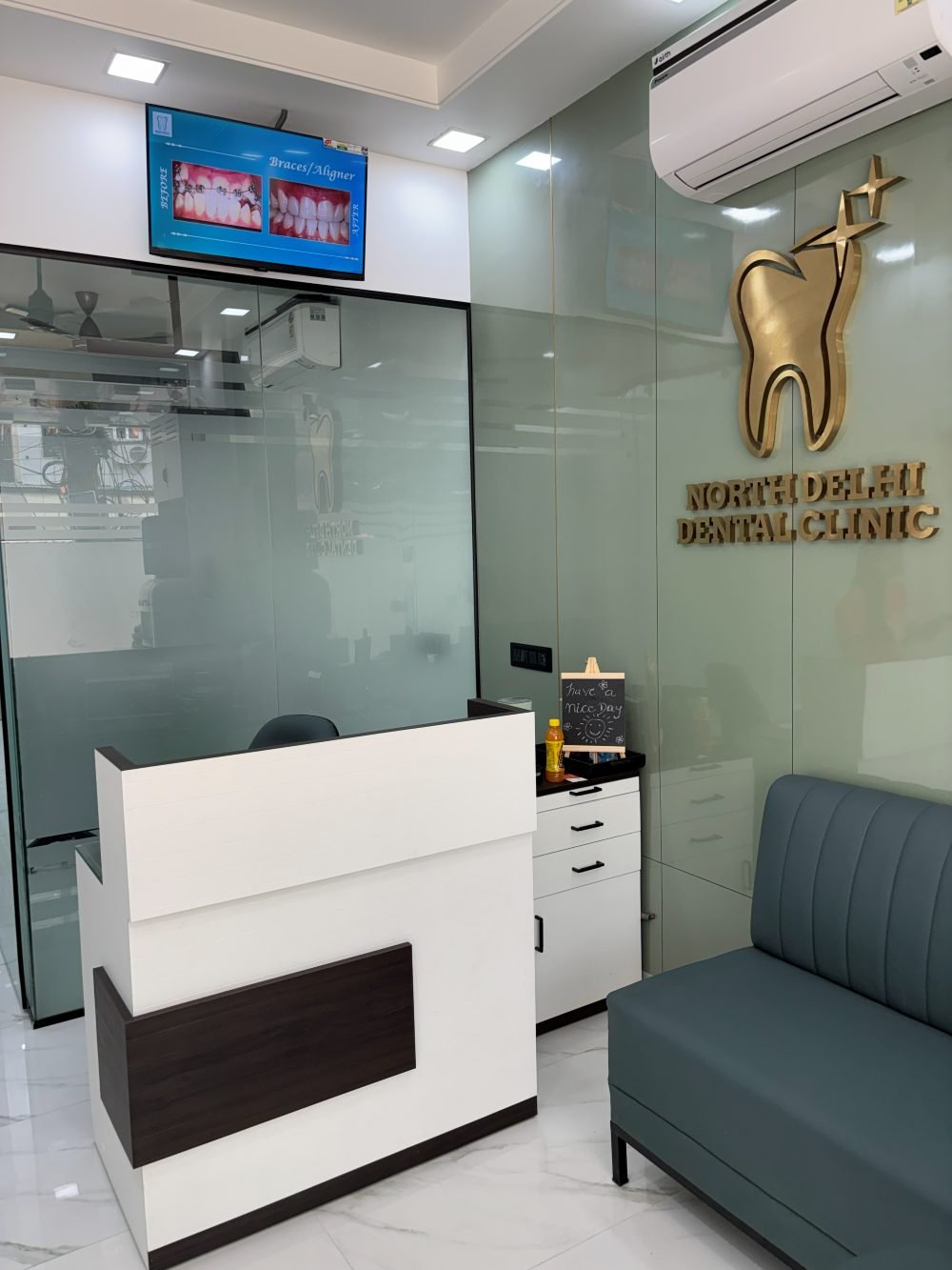 Reception front desk, waiting lounge and gold clinic logo