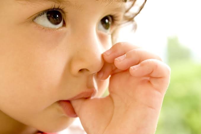 Young child sucking their thumb — thumb-sucking habit in children, North Delhi Dental Clinic